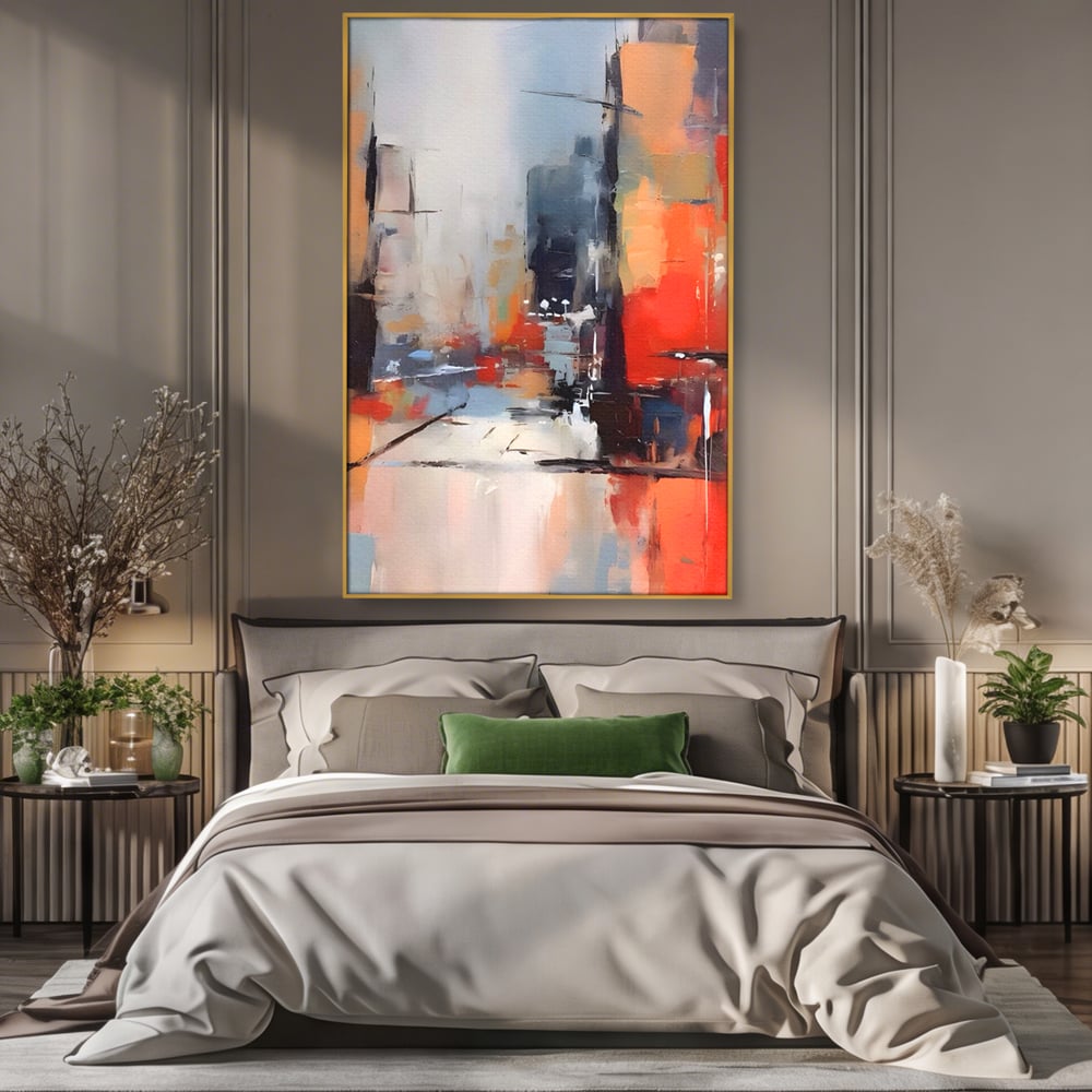 Tablou canvas cu pictura abstracta cu oras si cladiri, in rama de aluminiu auriu, pe perete intr-un dormitor